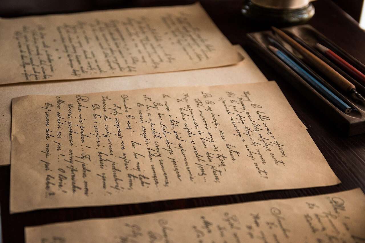 Handwritten pages and writing materials